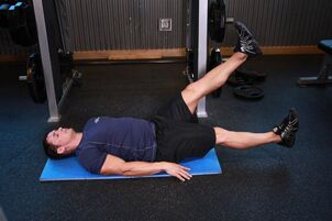 The man with the prostate performs an exercise in the gym